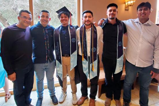 Picture of EE graduates participating in La Raza Graduation